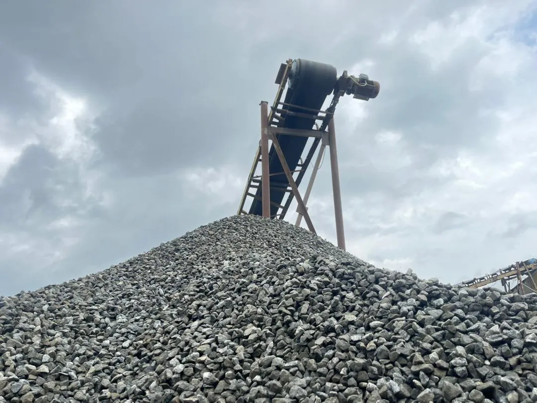 Conveyor building a stockpile of granite chippings at Akinchang's Owena Quarry